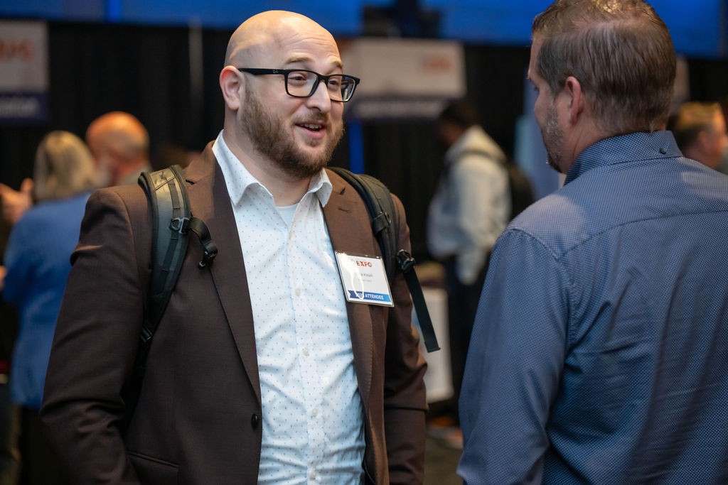 Two attendees conversing