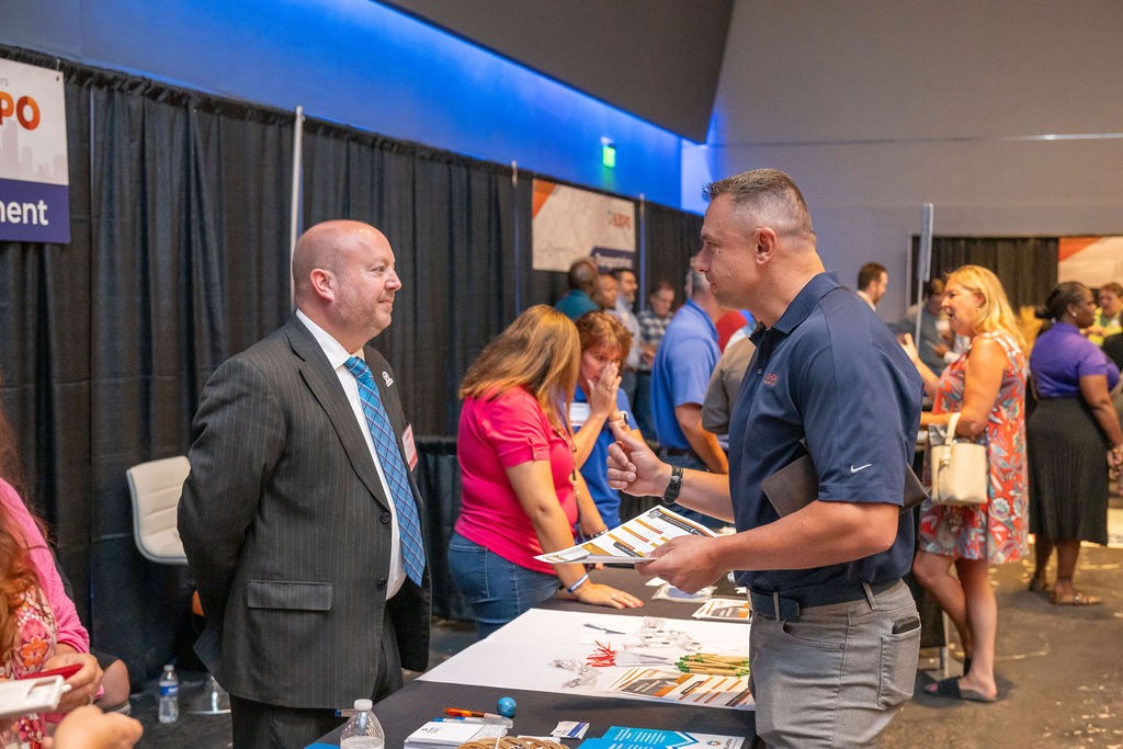 Energy and Environment booth staff interacting with supplier attendees