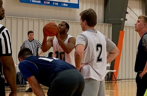 person shooting a free throw