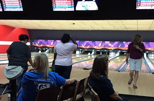 three women bowling
