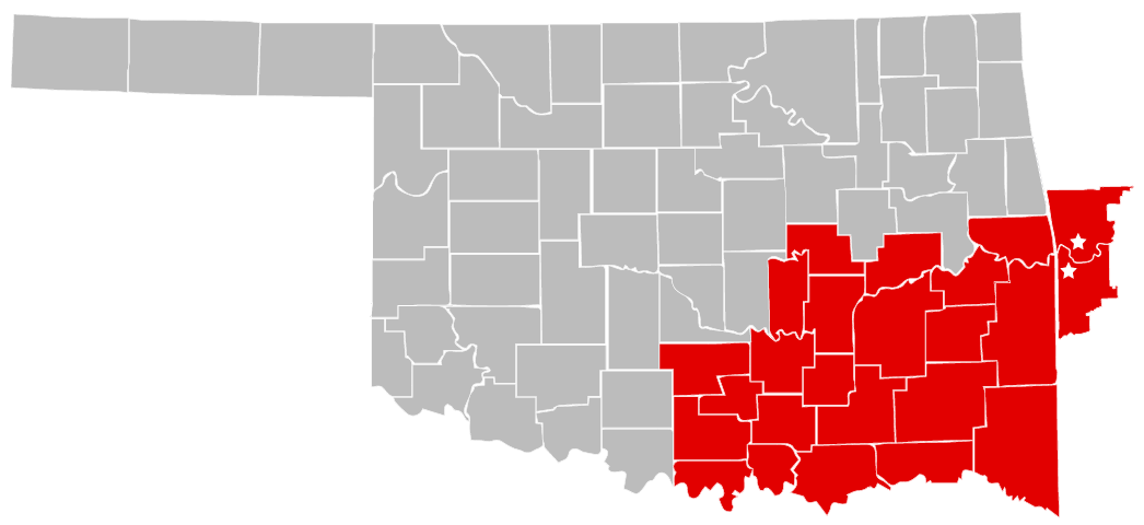 oklahoma map of all counties and the southeast area counties are highlighted red and two western arkansas counties